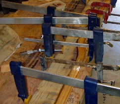 The bent laminates being glued together